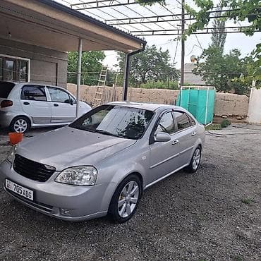 e 55 amg: Седан класса C, серебристый цвет кузова. Компактные размеры и удобная — 3