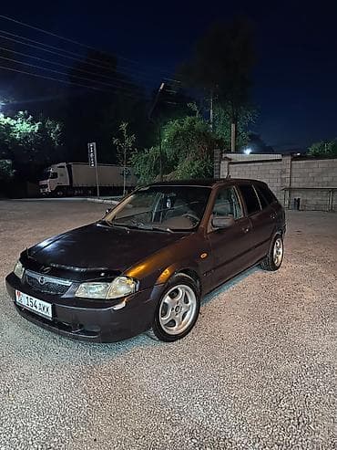 x5 bmb: Mazda 323: 1999 г., 1.5 л, Механика, Бензин, Хэтчбэк — 1