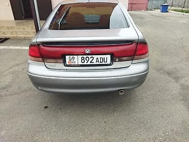 кузов таза: Mazda 626: 1992 г., Лифтбек — 5