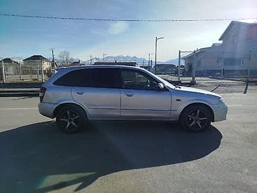 Унаа: Mazda 323: 2001 г., 1.6 л, Кол менен иштөөчү, Бензин, Хетчбек — 5