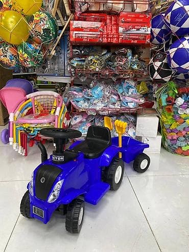 вещи каракол: Детский трактор-каталка электрический с прицепом, с музыкой синего — 2