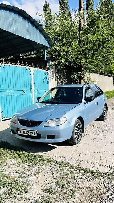 Транспорт: Mazda Familia: 2001 г., 1.5 л, Автомат, Бензин, Универсал — 2