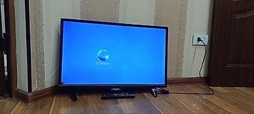 Телевизор Skyworth, диагональ примерно 32" (80 см). LED‑подсветка