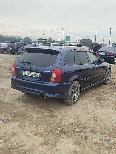 bme e34: Mazda Familia: 2002 г., 1.6 л, Ручные, Универсал — 6