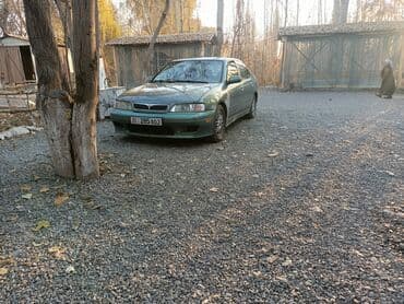 значок на авто: Nissan Primera: 2000 г., 2 л, Автомат, Бензиновая, Седан — 3