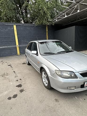 Mazda 323: 2004 г., Хэтчбэк — 7