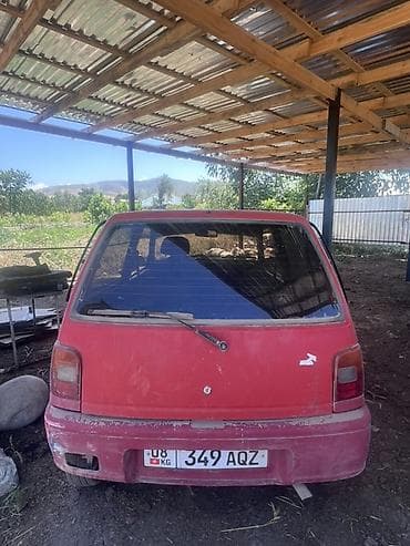 масла прес: Daihatsu Cuore: 1994 г., 0.8 л, Механика, Бензин, Купе — 5