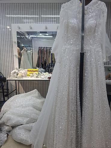 Свадебное платье с богатой вышивкой и сияющим декором. - Силуэт