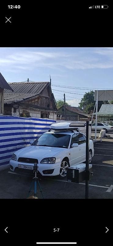 антенны для авто: Седан белого цвета с левым рулем. Кузов с тонированными стеклами — 3