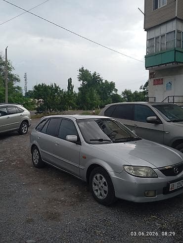 выхлоп 211: Mazda Familia: 2003 г., 1.6 л, Бензин, Хэтчбэк — 1