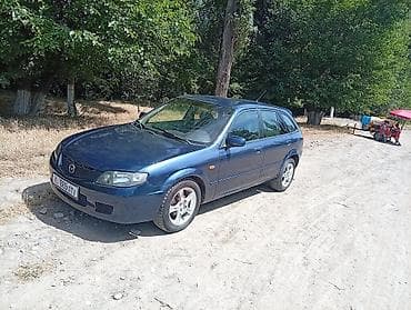 rd 1: Mazda 323: 2003 г., 1.6 л, Механика, Бензин, Универсал — 1