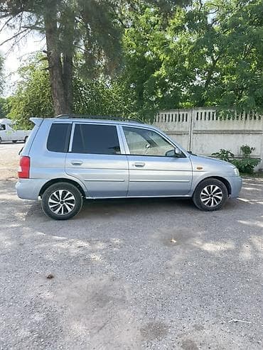 бар авто: Mazda Demio: 2001 г., 1.3 л, Кол менен иштөөчү, Бензин, Хетчбек — 10