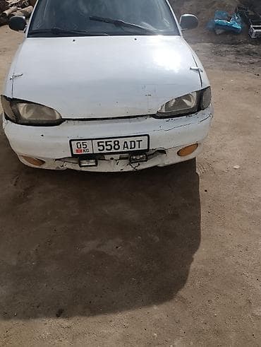 Автомобиль седан, белый цвет, на киргизских номерах (KG, регион 05