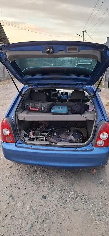 Mazda 323: 2002 г., Механика, Бензин, Хэтчбэк — 5