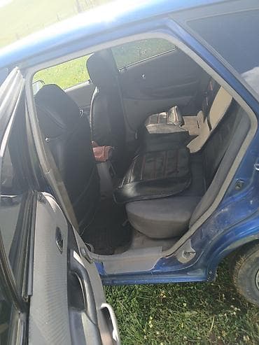 man 8: Mazda 323: 2003 г., 1.6 л, Механика, Бензин, Хэтчбэк — 4