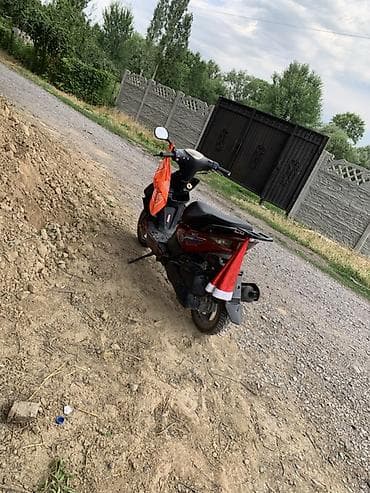Транспорт: Скутер 50 сс, городской класс. Описание: - Компактный скутер красного — 4