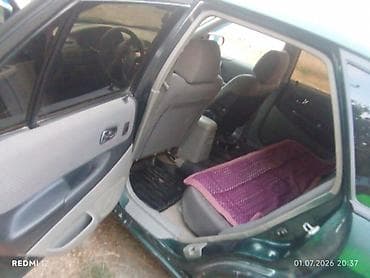 e 303: Mazda Familia: 2003 г., Универсал — 5