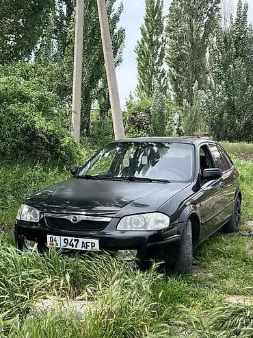 Унаа сатуу: Mazda 323: 1999 г., 1.5 л, Кол менен иштөөчү, Бензин, Хетчбек — 1