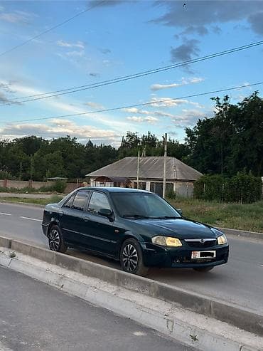 Mazda 323: 2000 г., 1.3 л, Механика, Бензин, Седан