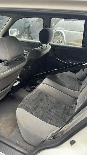 ас машина: Mazda Familia: 1999 г., 1.8 л, Механика, Бензин, Универсал — 6