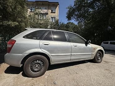 Mazda 323: 2001 г., 1.5 л, Автомат, Бензин, Универсал — 6