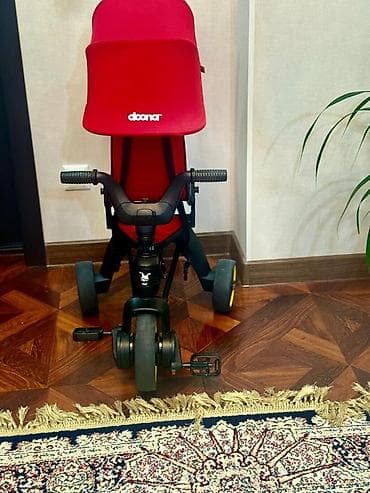 Велосипеды: Детский трицикл Doona Liki Trike с козырьком - Компактный складной — 1
