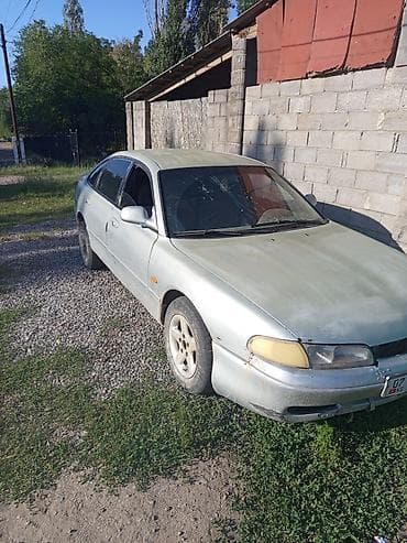Унаа: Mazda 626: 1992 г., Кол менен иштөөчү, Седан — 2
