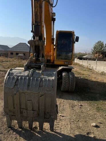 покрышка на погрузчик цена: Экскаватор, Колесный — 1
