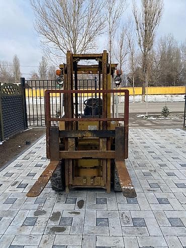 донголок погрузчик: Погрузчик, 1993 г., Колесный, Вилочный — 2