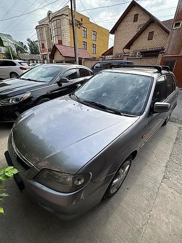infinity fx35: Mazda 323: 2003 г., 1.6 л, Автомат, Бензин, Универсал — 6