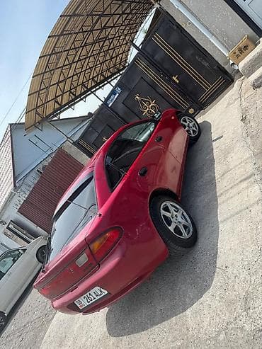 mini coper: Mazda 323: 1995 г., Механика, Бензин — 3