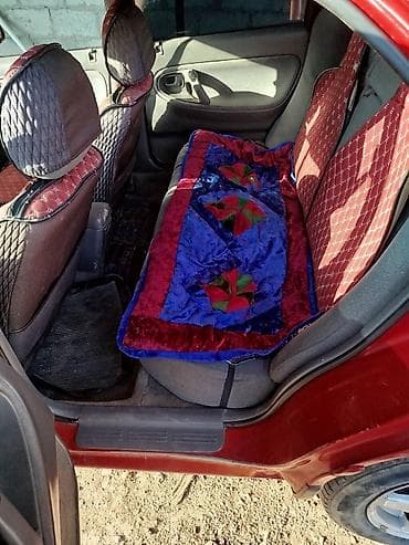 кирг шёлк: Mazda 323: 1995 г., Седан — 6