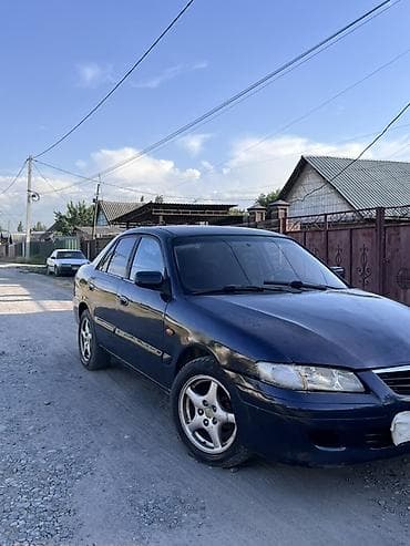 стоп gx: Mazda 626: 2000 г., 2 л, Механика, Бензин, Седан — 2