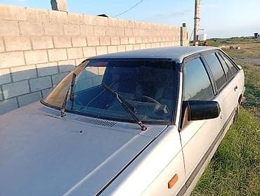 люк 124: Mazda 626: 1990 г., Хэтчбэк — 1
