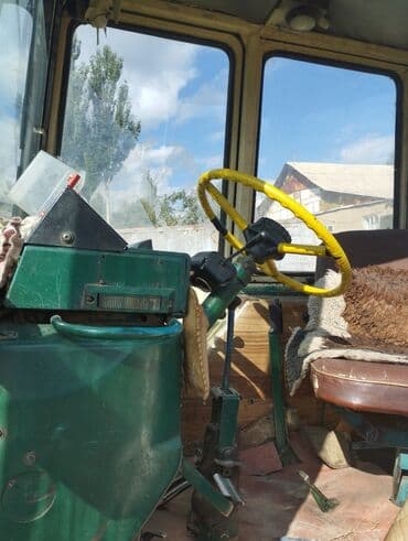 гидравлический домкраты: Трактор-экскаватор с комбинированным функционалом, предназначенный для — 2