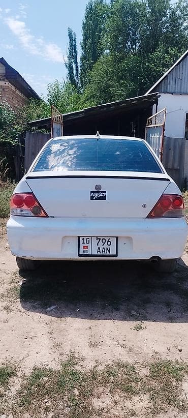 Транспорт: Mitsubishi Lancer: 2000 г., 1.5 л, Механика, Бензин, Седан — 2