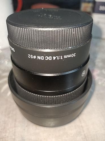 материал на чехол: Объектив Sigma 30mm f/1.4 DC DN (диаметр фильтра 52 мм) - Фокусное — 4