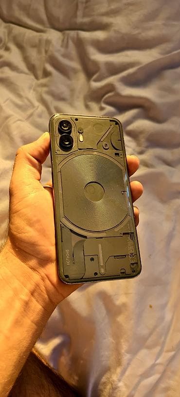 Nothing Phone (2), черный/тёмно‑серый. Ключевые характеристики: - — 1