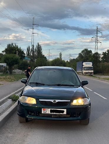 мазду: Mazda 323: 2000 г., 1.3 л, Механика, Бензин, Седан — 2