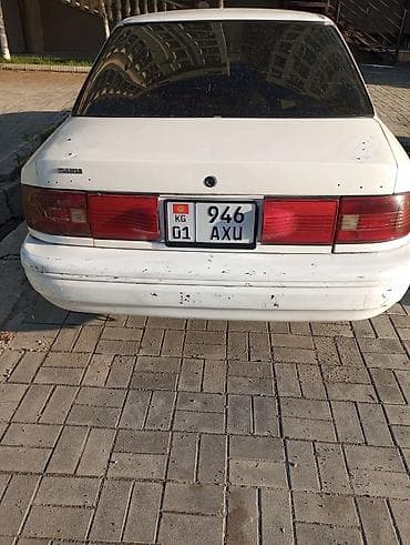 малибо: Mazda 323: 1997 г., Механика, Седан — 6
