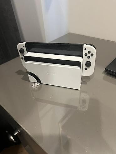 Nintendo Switch OLED: Nintendo Switch OLED (модель HEG-001) — белая версия Комплектация по — 2
