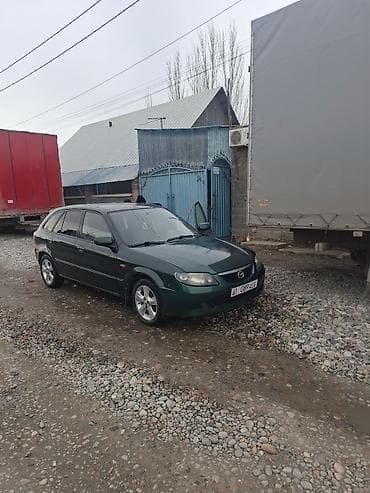 mini copper: Mazda 323: 2002 г., 1.6 л, Механика, Универсал — 7