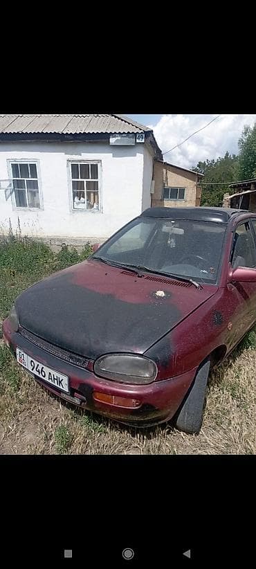 Mazda 121: 1994 г., 1.3 л, Кол менен иштөөчү, Бензин, Седан — 1