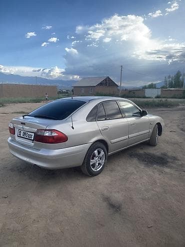 илизон машына: Mazda Capella: 1998 г., 2 л, Кол менен иштөөчү, Бензин, Седан — 1