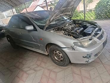 тенир тоо: Mazda 323: 2002 г., 1.6 л, Кол менен иштөөчү, Бензин, Седан — 5