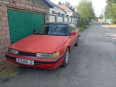 кассеты аудио: Mazda 626: 1988 г., Механика, Бензин — 1