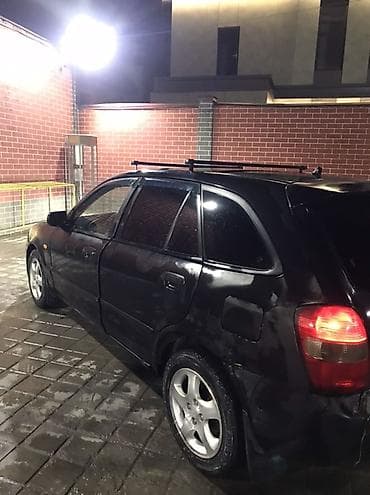 bmw e34 1995: Mazda Familia: 2001 г., Универсал — 4