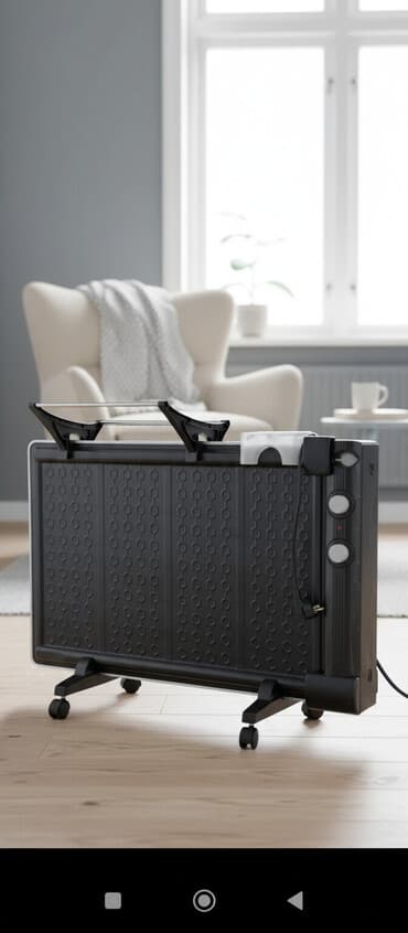 Масляный радиатор (панельного типа) на колесиках. Характеристики и