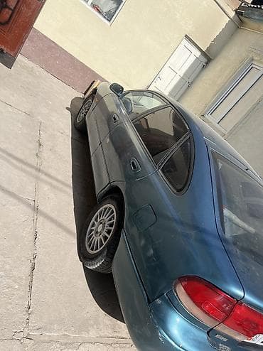 2 8: Mazda 626: 1992 г., 2 л, Седан — 4