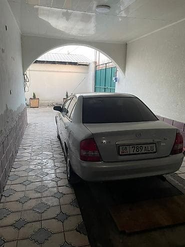 фередо 124: Mazda Familia: 2003 г., 1.6 л, Ручные, Бензин, Седан — 5